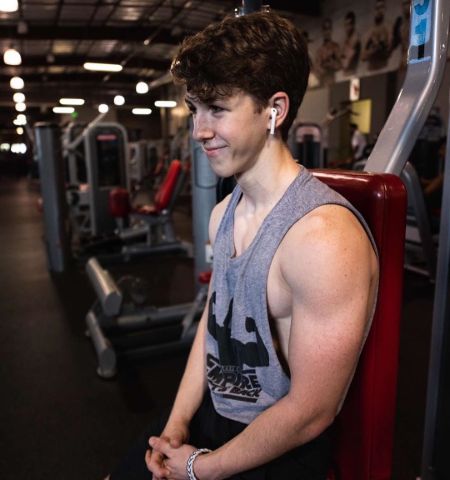 Ethan Wacker working out in a gym.